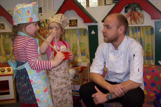 Head Chef Chris White with two budding young chefs at the Cirencester Opportunity Group